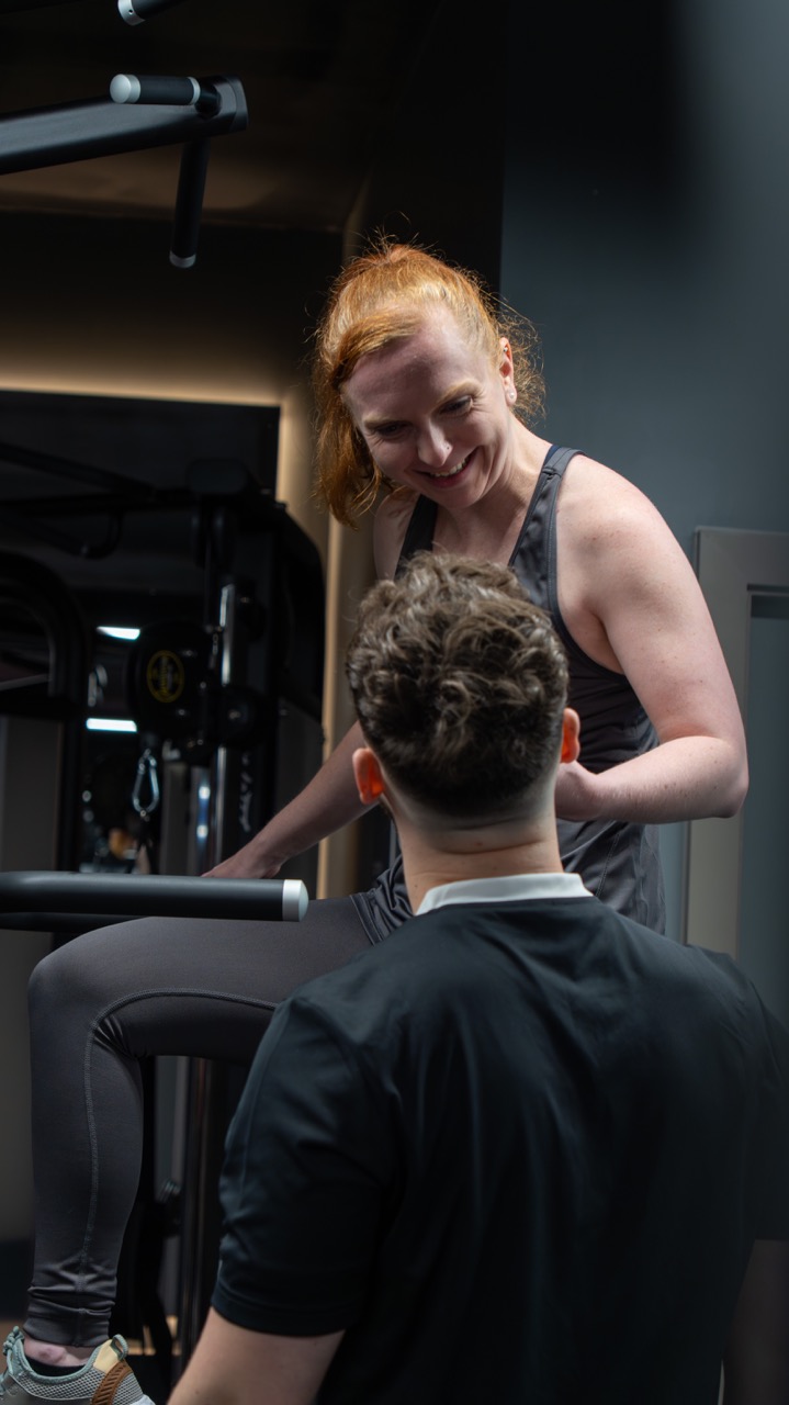 ECPT client smiling mid-session at Snap Fitness Redditch